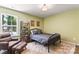 Comfortable bedroom with an accent chair, lots of natural light, and stylish decor at 6425 Pamela St, Huntersville, NC 28078