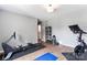 Functional gym area with a stationary bike, rowing machine, and exercise mat at 6425 Pamela St, Huntersville, NC 28078