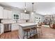 Bright, modern kitchen with island, stainless steel appliances, and open to a cozy living area at 6425 Pamela St, Huntersville, NC 28078
