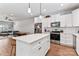 This modern kitchen boasts stainless steel appliances, white cabinets, and a functional center island at 6425 Pamela St, Huntersville, NC 28078