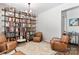 Inviting living room features a custom bookshelf, ample seating, and a stylish area rug at 6425 Pamela St, Huntersville, NC 28078