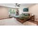 Bright and airy main bedroom with a seating area, large windows, and contemporary decor elements at 6425 Pamela St, Huntersville, NC 28078