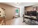 Bright office space features a large window, closet, and modern desk setup at 6425 Pamela St, Huntersville, NC 28078