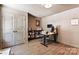 Functional office with a large closet, modern desk, and neutral color scheme at 6425 Pamela St, Huntersville, NC 28078
