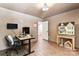 Office space with a desk, neutral walls, and a dollhouse in the corner at 6425 Pamela St, Huntersville, NC 28078