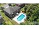 Aerial view of backyard pool with home and patio at 704 Millstream Dr, Rock Hill, SC 29732