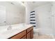 Bright bathroom with double vanity, tub and shower combo and neutral color palette at 704 Millstream Dr, Rock Hill, SC 29732