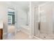 Bright bathroom featuring a separate shower and tub with tile flooring and white color scheme at 704 Millstream Dr, Rock Hill, SC 29732