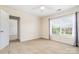 Well-lit bedroom with carpet, light walls, white trim, a ceiling fan and large window at 704 Millstream Dr, Rock Hill, SC 29732