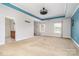 Bright bedroom with a ceiling fan, carpet, and a view to attached bathroom at 704 Millstream Dr, Rock Hill, SC 29732