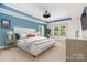 A spacious bedroom with a fan and tray ceilings at 704 Millstream Dr, Rock Hill, SC 29732
