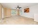 Spacious carpeted bedroom with a ceiling fan, two windows, and a neutral color scheme at 704 Millstream Dr, Rock Hill, SC 29732