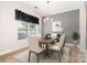 This dining room features a chandelier and a window with black curtains at 704 Millstream Dr, Rock Hill, SC 29732