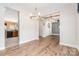 Open dining area featuring wood floors and modern light fixtures at 704 Millstream Dr, Rock Hill, SC 29732