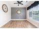 Flex room with hardwood floors, modern light fixture, ceiling fan and accent wall at 704 Millstream Dr, Rock Hill, SC 29732