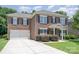 Charming brick home with a two-car garage and well-maintained landscaping at 704 Millstream Dr, Rock Hill, SC 29732