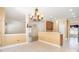 Open kitchen showcasing countertops, cabinetry, and seamless flow to dining area and living space at 704 Millstream Dr, Rock Hill, SC 29732