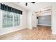 Bright living room highlighting natural light, wood floors, and open access to entry at 704 Millstream Dr, Rock Hill, SC 29732