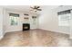 Bright living room featuring a fireplace, wood floors, and ample natural light at 704 Millstream Dr, Rock Hill, SC 29732