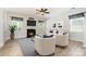 Bright living room with a fireplace, neutral paint, ceiling fan, and lots of comfortable seating at 704 Millstream Dr, Rock Hill, SC 29732