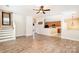 Spacious living room with hardwood floors, staircase, and view of the open kitchen at 704 Millstream Dr, Rock Hill, SC 29732