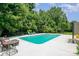 Outdoor pool featuring patio, lounge chairs, and lush landscaping at 704 Millstream Dr, Rock Hill, SC 29732