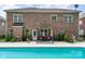 Relaxing pool with seating area and landscaped yard at 704 Millstream Dr, Rock Hill, SC 29732