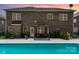 Backyard pool area featuring brick home, and outdoor seating at 704 Millstream Dr, Rock Hill, SC 29732