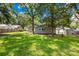 A sprawling backyard with mature trees, offering a peaceful and private outdoor retreat at 716 W Graham St, Shelby, NC 28150