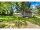 An expansive backyard with mature trees providing shade and privacy at 716 W Graham St, Shelby, NC 28150