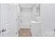 Updated bathroom featuring a shower and tub combo and a modern vanity with storage at 716 W Graham St, Shelby, NC 28150
