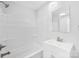 Clean bathroom with a shower-tub combo, sleek vanity, and neutral color scheme at 716 W Graham St, Shelby, NC 28150