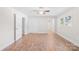 Spacious bedroom with wood-look flooring, ample natural light, and a neutral color palette at 716 W Graham St, Shelby, NC 28150
