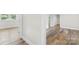 Bright bedroom featuring wood-look flooring, natural light, and fresh neutral paint at 716 W Graham St, Shelby, NC 28150