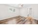 Bright bedroom features wood flooring, modern ceiling fan, and ensuite bathroom at 716 W Graham St, Shelby, NC 28150