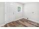 Mud room with wood-look flooring, a rear entrance, and space for a washer and dryer at 716 W Graham St, Shelby, NC 28150