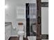 Bathroom featuring a granite countertop sink and a glass shower, with dark accent tiles at 720 4Th St, Stanley, NC 28164