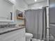 Bathroom with granite countertop, a mirror, a toilet, and a shower with a curtain at 720 4Th St, Stanley, NC 28164