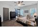 Spacious bedroom offers natural light, wood flooring, and an attached bathroom with a glass shower at 720 4Th St, Stanley, NC 28164