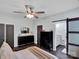 Stylish bedroom features wood floors, large windows, a barn door to the bathroom, and modern decor at 720 4Th St, Stanley, NC 28164