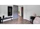 Cozy bedroom with wood floors, neutral walls, workout equipment, and modern decor at 720 4Th St, Stanley, NC 28164
