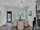 Dining area featuring round table, four chairs, light fixture, and view to backyard at 720 4Th St, Stanley, NC 28164