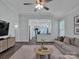 Bright and spacious living room open to the kitchen, perfect for entertaining at 720 4Th St, Stanley, NC 28164