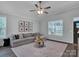 Bright and spacious living room with a large window and comfortable seating at 720 4Th St, Stanley, NC 28164