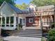 Beautiful backyard featuring a covered patio, outdoor seating, and lush landscaping, creating a relaxing atmosphere at 7408 Mockingbird Ln, Waxhaw, NC 28173