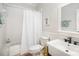 Well-lit bathroom with a tub and shower combination and a white shower curtain at 7408 Mockingbird Ln, Waxhaw, NC 28173