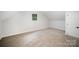 Cozy bedroom with carpet and natural lighting through a window at 7408 Mockingbird Ln, Waxhaw, NC 28173