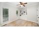 Comfortable bedroom with natural light, built-in bookshelves, and hardwood floors at 7408 Mockingbird Ln, Waxhaw, NC 28173