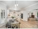 Open dining area showcasing an adjacent modern kitchen perfect for entertaining and Gathering meals at 7408 Mockingbird Ln, Waxhaw, NC 28173