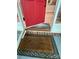 Welcome mat at the entrance to a home with a bright red front door at 7408 Mockingbird Ln, Waxhaw, NC 28173
